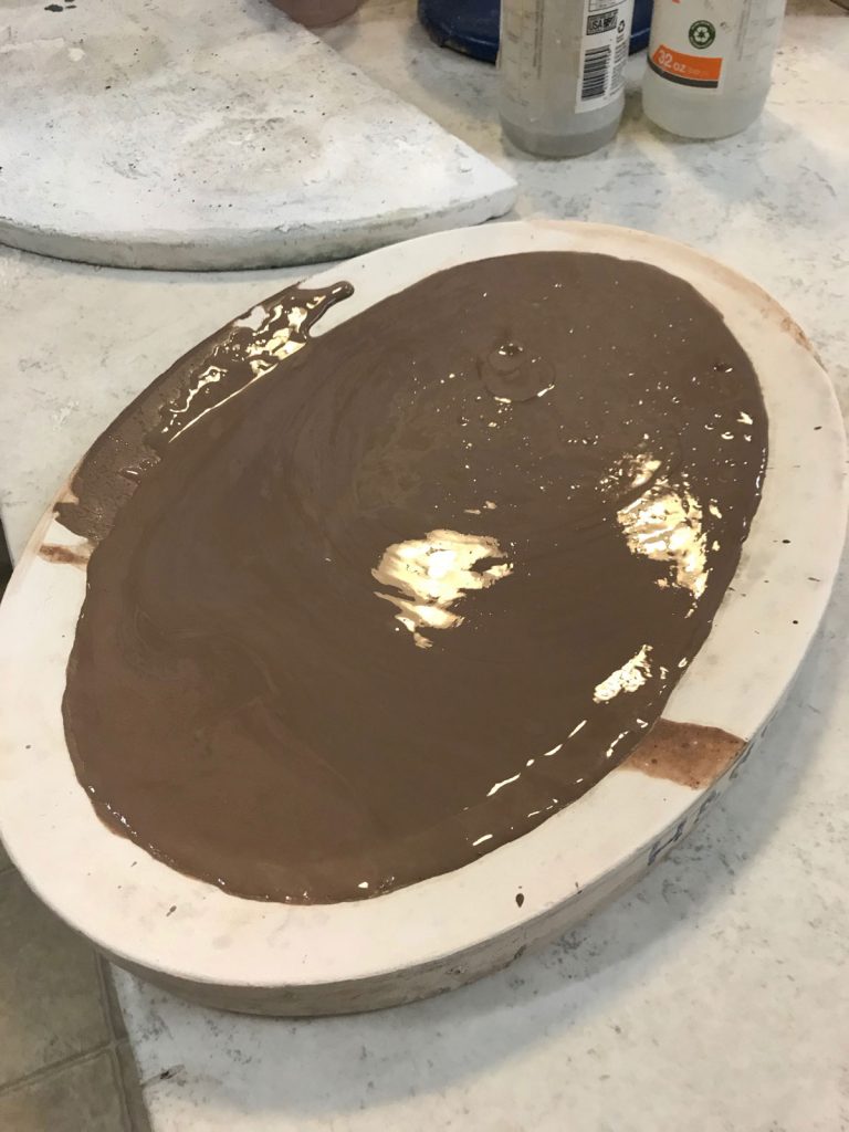 reclaiming clay sludge, sludge is drying on plaster form